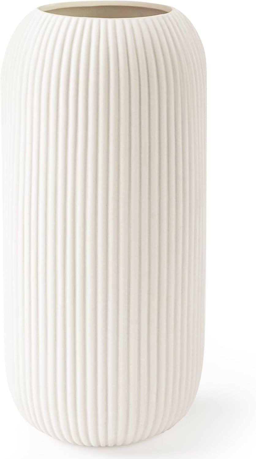 Our Review of the Modern Ribbed Ceramic Vase That Elevates Any Space
ChatGPT: I'll explore what we've discovered in examining this ceramic vase for flowers. It's a modern, small, ribbed, textured flower vase that's perfect for home decor, pampas grass, and decorative purposes. The vase can be used for farmhouse, coffee table, kitchen centerpieces, bookshelf, and home living in white